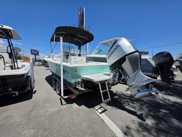 Slide: The Image of 2023 C-Hawk 25 Center Console boat with Honda outboard motor. - 10