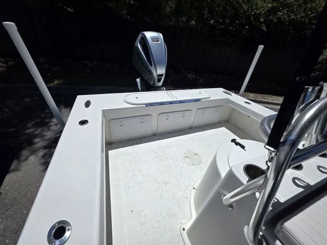 Slide: The Image of 2023 C-Hawk 25 Center Console with outboard motor. - 12