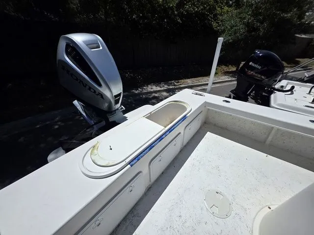 Slide: The Image of 2023 C-Hawk 25 Center Console with Honda outboard motor. - 14