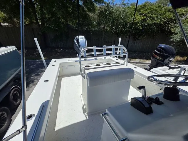 Slide: The Image of 2023 C-Hawk 25 Center Console boat with helm and seating area. - 16