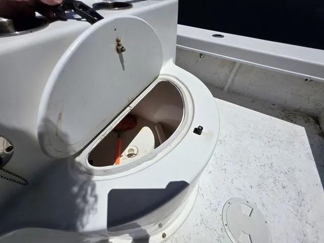 Slide: The Image of Open storage compartment on a 2023 C-Hawk 25 Center Console boat. - 17