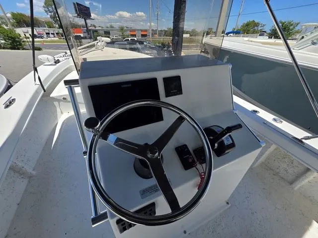 Slide: The Image of C-Hawk 25 Center Console 2023 helm with steering wheel and instruments. - 19