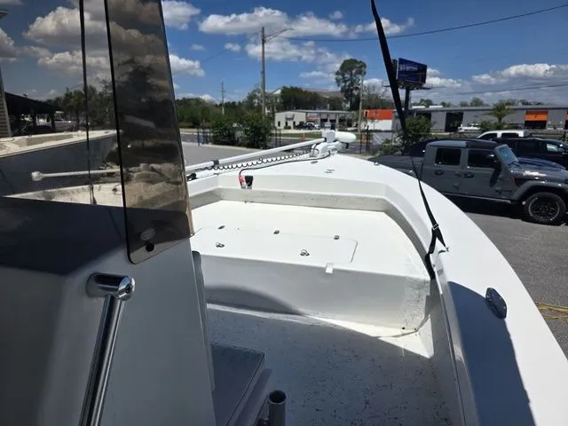 Slide: The Image of C-Hawk 25 Center Console boat, 2023 model, parked under sunny skies. - 20