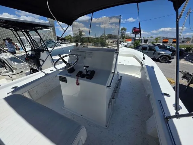 Slide: The Image of 2023 C-Hawk 25 Center Console with helm and seating area. - 21