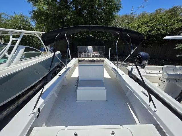 Slide: The Image of 2023 C-Hawk 25 Center Console boat with black canopy. - 22
