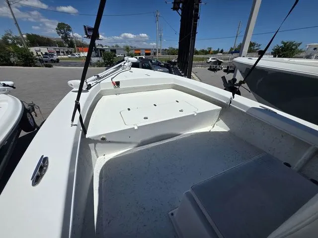 Slide: The Image of C-Hawk 25 Center Console boat, 2023 model, parked outdoors. - 24