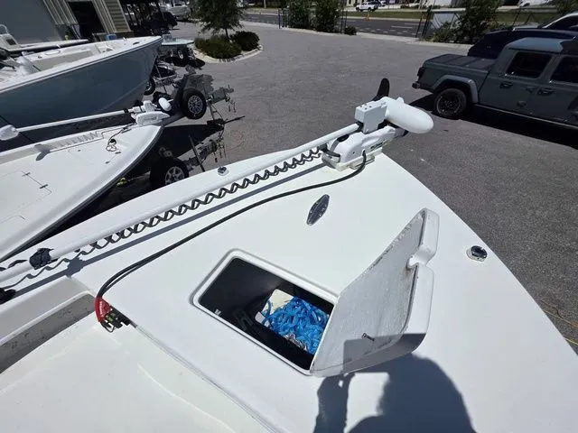 Slide: The Image of 2023 C-Hawk 25 Center Console with open storage compartment and accessories. - 26