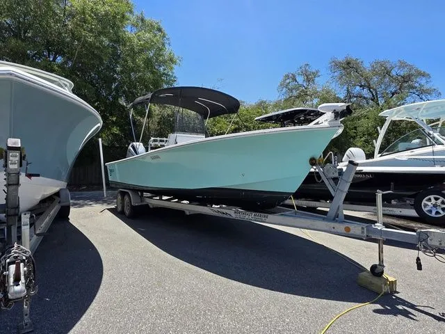 Slide: The Image of 2023 C-Hawk 25 Center Console boat on trailer outdoors. - 4