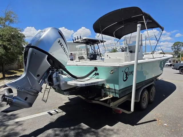 Slide: The Image of 2023 C-Hawk 25 Center Console boat with Honda outboard motor. - 5