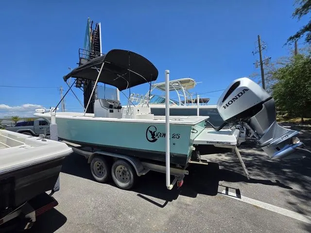 Slide: The Image of 2023 C-Hawk 25 Center Console boat with Honda outboard motor. - 9