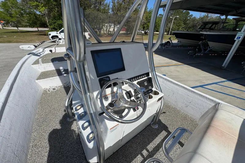 Slide: The Image of 2021 Blazer Bay 2400 boat console with steering wheel and navigation screen. - 31