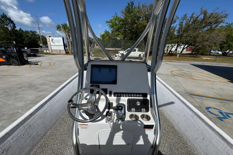 Slide: The Image of 2021 Blazer Bay 2400 boat console with steering wheel and control panel. - 32