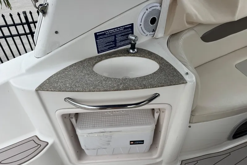 Slide: The Image of 2009 Chaparral Signature 250 boat interior with sink and storage compartment. - 12