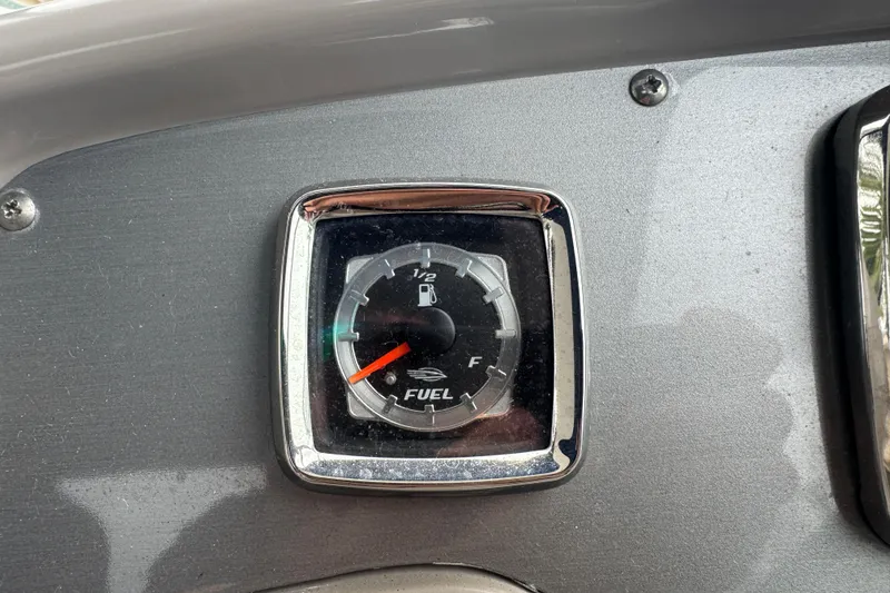 Slide: The Image of Fuel gauge of 2009 Chaparral Signature 250 boat, showing near empty. - 21