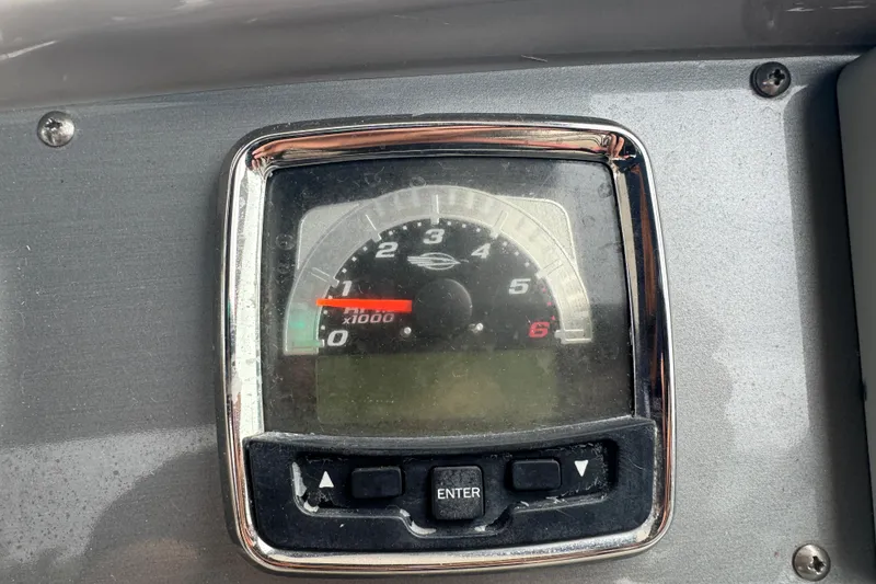 Slide: The Image of Dashboard tachometer of 2009 Chaparral Signature 250 boat, showing RPM gauge. - 22