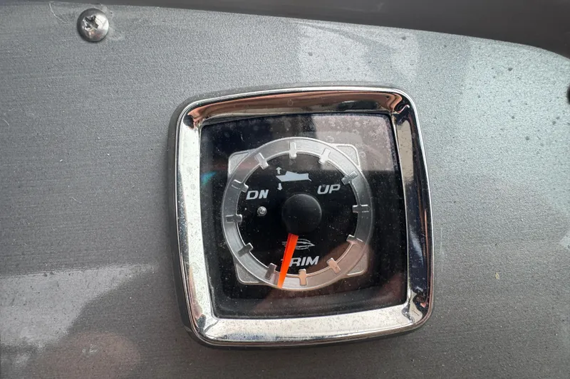 Slide: The Image of Trim gauge on 2009 Chaparral Signature 250 boat dashboard. - 25