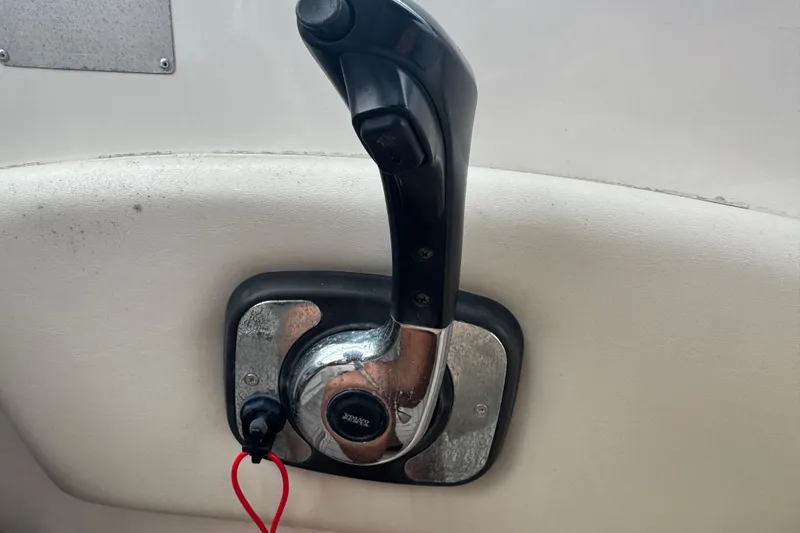 Slide: The Image of Throttle control lever on a 2009 Chaparral Signature 250 boat. - 31