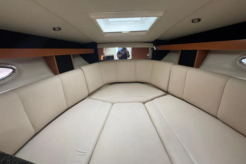 Slide: The Image of Interior cabin of 2009 Chaparral Signature 250 boat with beige seating and skylight. - 35