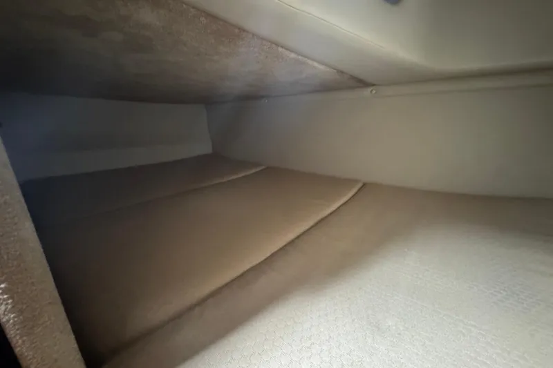Slide: The Image of Interior cabin view of 2009 Chaparral Signature 250 boat, featuring cozy sleeping area. - 36
