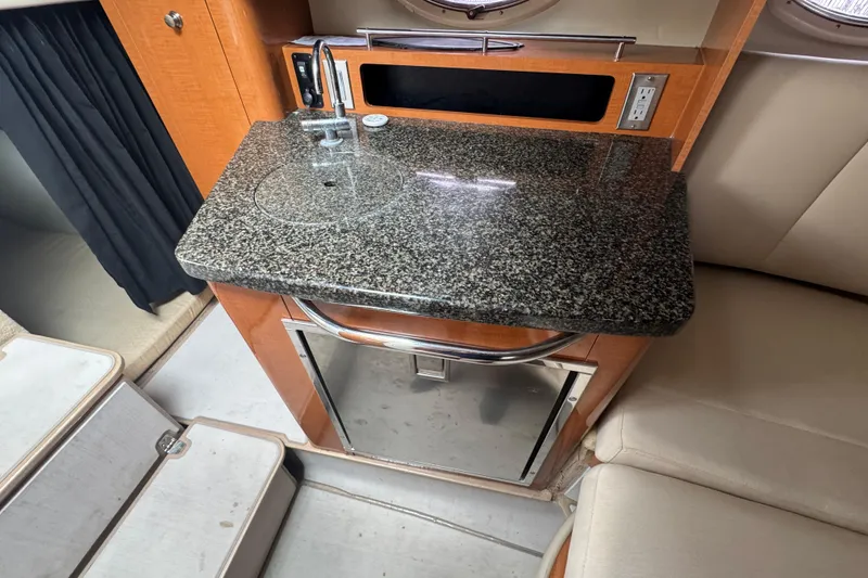 Slide: The Image of 2009 Chaparral Signature 250 boat interior with granite countertop and sink. - 38