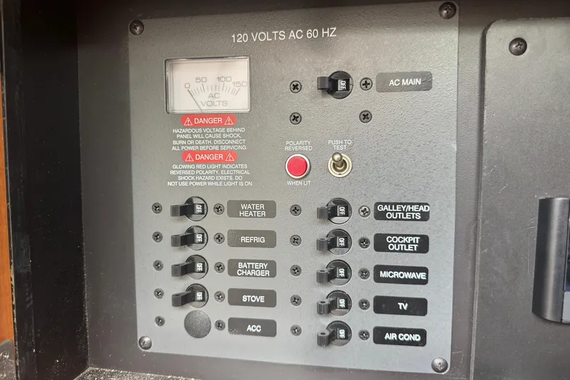 Slide: The Image of 2009 Chaparral Signature 250 electrical panel with switches and voltage meter. - 43