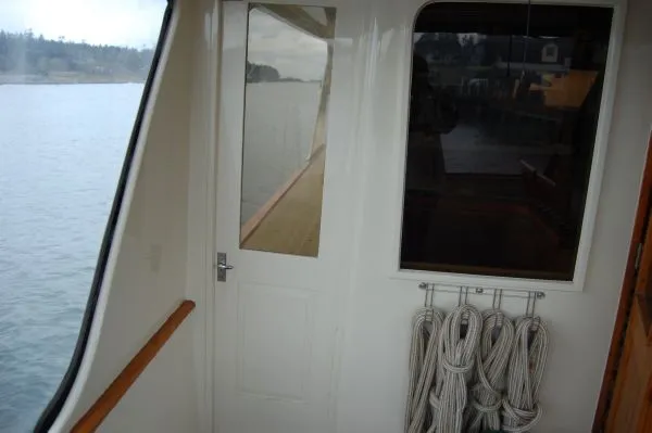 Slide: The Image of 1982 Kong & Halvorsen Island Gypsy yacht with ropes on the wall. - 10