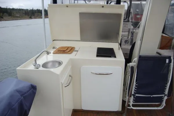 Slide: The Image of Galley area on a 1982 Kong & Halvorsen Island Gypsy boat. - 13