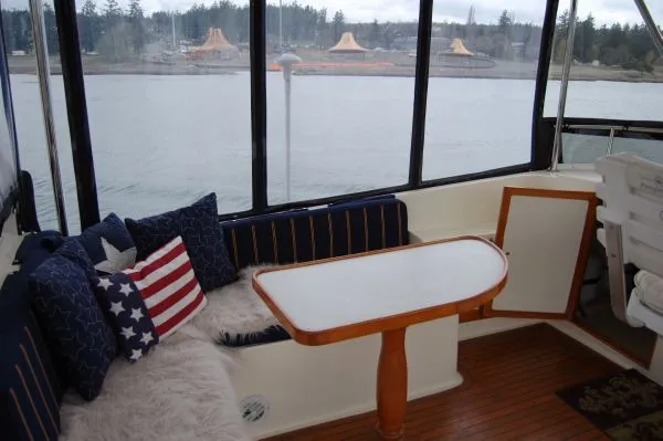 Slide: The Image of Interior of a 1982 Kong & Halvorsen Island Gypsy yacht with cozy seating area. - 19