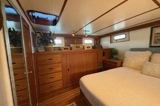 Slide: The Image of 1982 Kong & Halvorsen Island Gypsy yacht interior with cozy bedroom and wooden cabinetry. - 30