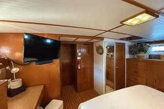 Slide: The Image of 1982 Kong & Halvorsen Island Gypsy yacht interior with wood paneling and modern amenities. - 32