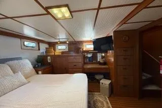 Slide: The Image of 1982 Kong & Halvorsen Island Gypsy yacht cabin with cozy bed and wooden interior. - 33