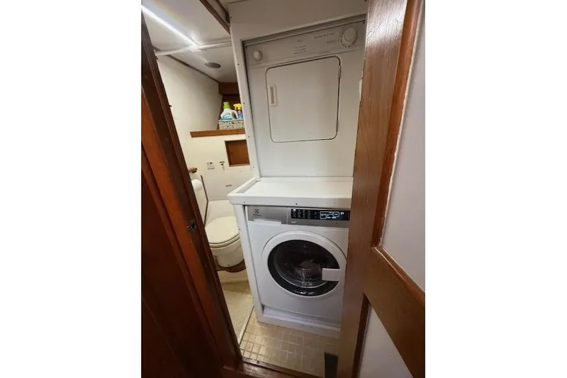 Slide: The Image of Laundry area with washer and dryer inside 1982 Kong & Halvorsen Island Gypsy boat. - 44