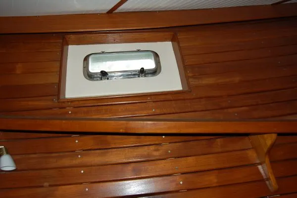 Slide: The Image of Wood paneling and porthole on 1982 Kong & Halvorsen Island Gypsy. - 47