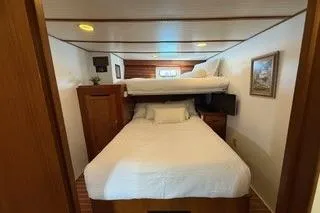 Slide: The Image of 1982 Kong & Halvorsen Island Gypsy cabin with bunk beds and cozy decor. - 49