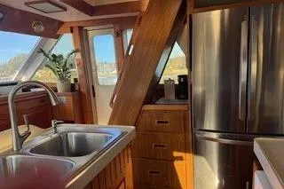 Slide: The Image of 1982 Kong & Halvorsen Island Gypsy yacht interior with modern kitchen and stainless steel appliances. - 65