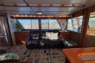 Slide: The Image of 1982 Kong & Halvorsen Island Gypsy yacht interior with leather sofa and panoramic windows. - 68