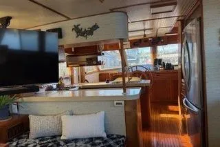 Slide: The Image of 1982 Kong & Halvorsen Island Gypsy yacht interior with modern amenities and wooden finishes. - 69