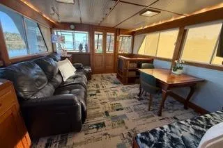 Slide: The Image of 1982 Kong & Halvorsen Island Gypsy yacht interior with leather sofa and dining area. - 71