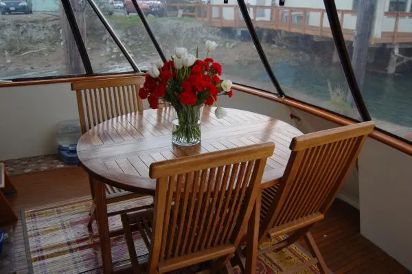 Slide: The Image of Wooden table with flower vase on a 1982 Kong & Halvorsen Island Gypsy yacht. - 8