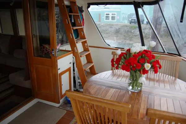 Slide: The Image of Interior of a 1982 Kong & Halvorsen Island Gypsy yacht with wooden furniture. - 9