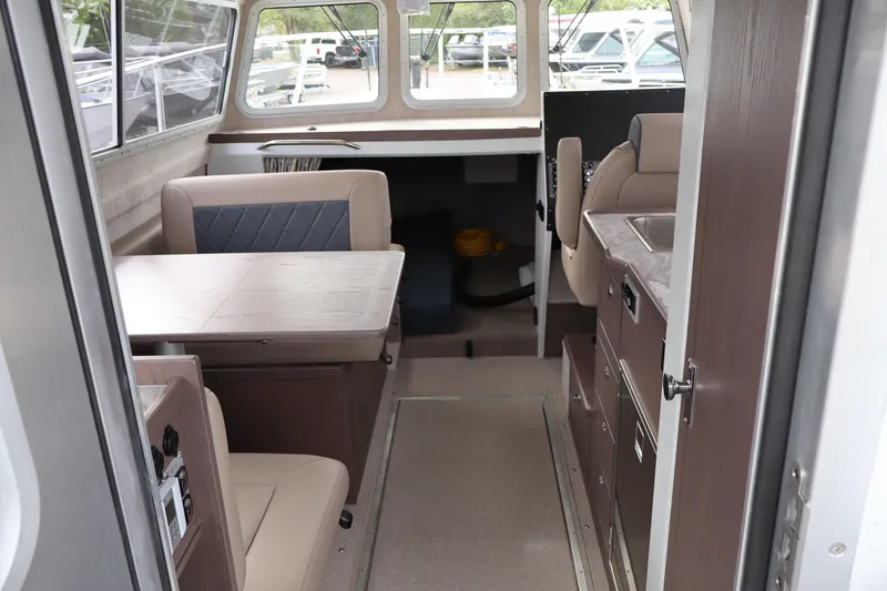 Slide: The Image of Interior of 2026 KingFisher 3025 XRS boat with seating and kitchenette. - 10
