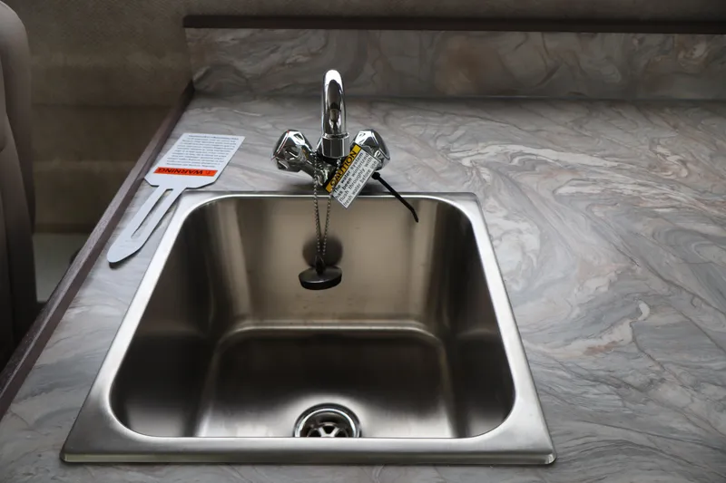 Slide: The Image of Stainless steel sink with faucet in 2026 KingFisher 3025 XRS boat kitchen. - 12