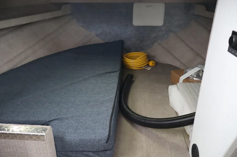 Slide: The Image of Interior cabin of 2026 KingFisher 3025 XRS boat with mattress and coiled hose. - 14