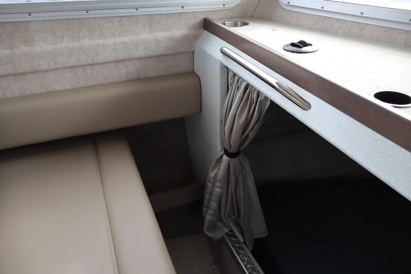 Slide: The Image of Interior of 2026 KingFisher 3025 XRS boat with beige seating and curtain. - 15