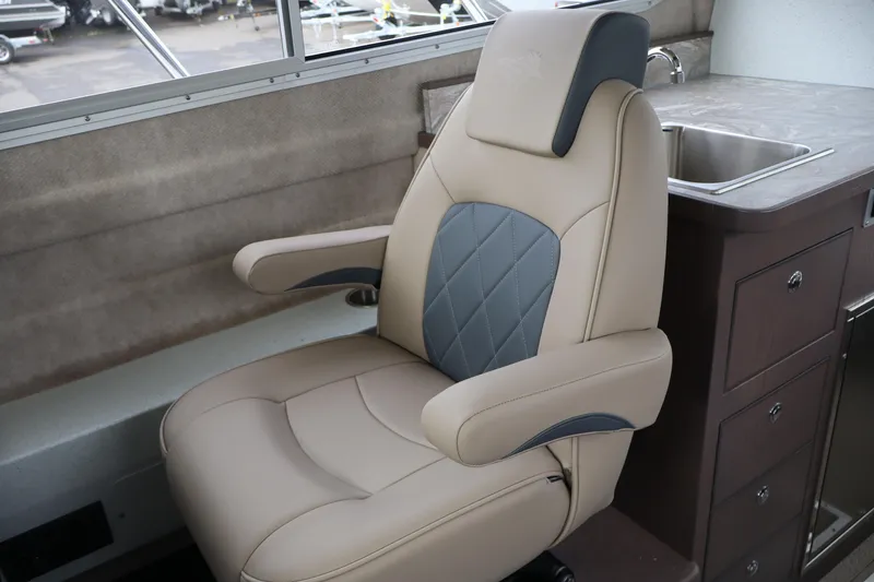Slide: The Image of Luxurious captain's chair in 2026 KingFisher 3025 XRS boat interior, featuring elegant design. - 16