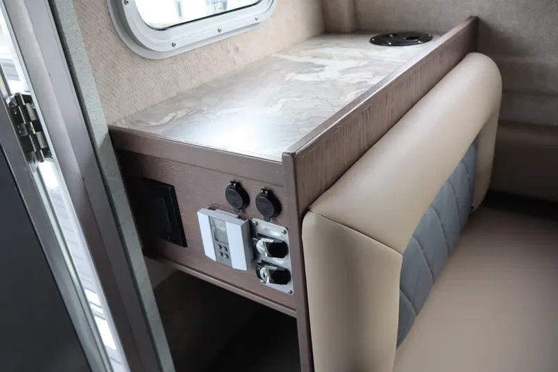 Slide: The Image of Interior of 2026 KingFisher 3025 XRS boat with modern seating and control panel. - 23