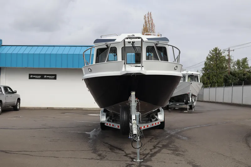Slide: The Image of 2026 KingFisher 3025 XRS boat on trailer, parked outside dealership. - 4