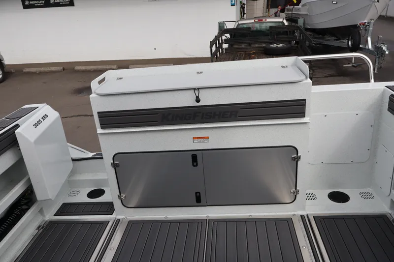 Slide: The Image of 2026 KingFisher 3025 XRS boat interior with storage compartments and sleek design. - 6