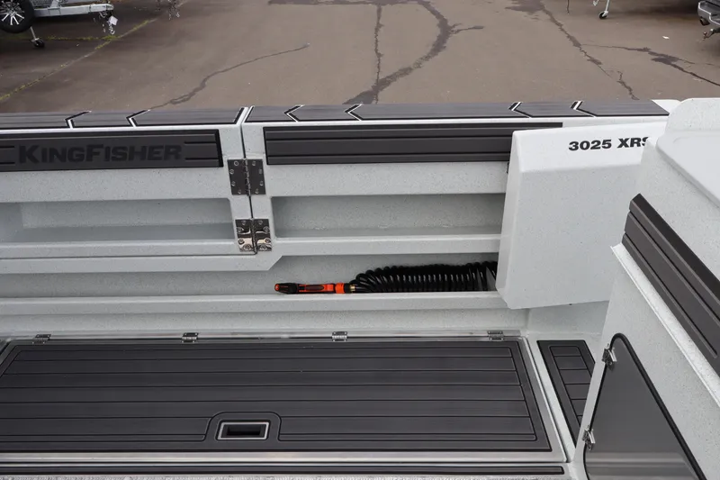 Slide: The Image of KingFisher 3025 XRS boat interior, showcasing storage compartments and sleek design, 2026 model. - 8