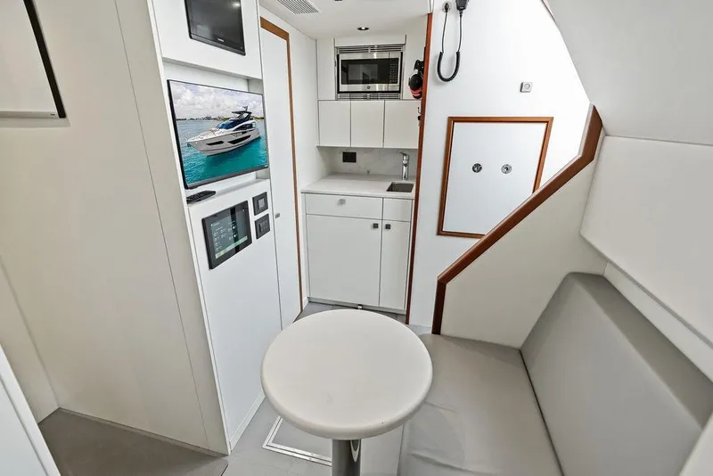 Slide: The Image of Modern interior of 2026 Sunseeker 88 Yacht with sleek kitchen and seating area. - 101